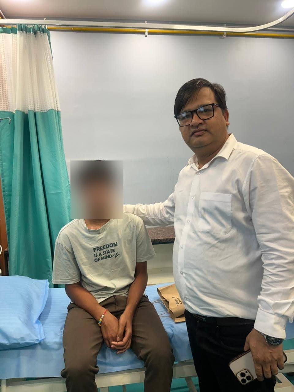 Doctor with a young patient after successful treatment