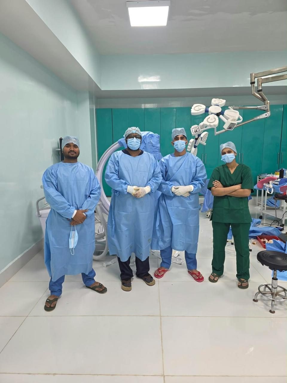 Surgeons and theatre staff standing in the operation theatre